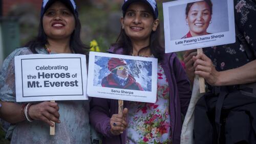 Women hold placards and photos of various record-holding climbers as they mark the 70 anniversary of the first ascent of Mount Everest in Kathmandu, Nepal, Monday, May 29, 2023. The 8,849-meter (29,032-foot) mountain peak was first scaled by New Zealander Edmund Hillary and his Sherpa guide Tenzing Norgay on May 29, 1953. (AP Photo/Niranjan Shrestha)