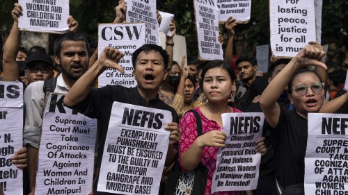 Students and activists shout slogans during a protest demonstration against the violence in the northeastern Indian state of Manipur, in New Delhi, India, Friday, July, 21, 2023. Deadly ethnic clashes in India's northeast rocked India's Parliament with the opposition blocking proceedings for a second straight day on Friday demanding the sacking of the top elected official of northeastern Manipur state where ethnic clashes have left more than 130 people dead since early May.  (AP Photo/Altaf Qadri)
