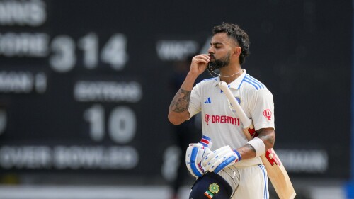 India's Virat Kohli celebrates after he scored a century against West Indies on day two of their second cricket Test match at Queen's Park in Port of Spain, Trinidad and Tobago, Friday, July 21, 2023. (AP Photo/Ricardo Mazalan)