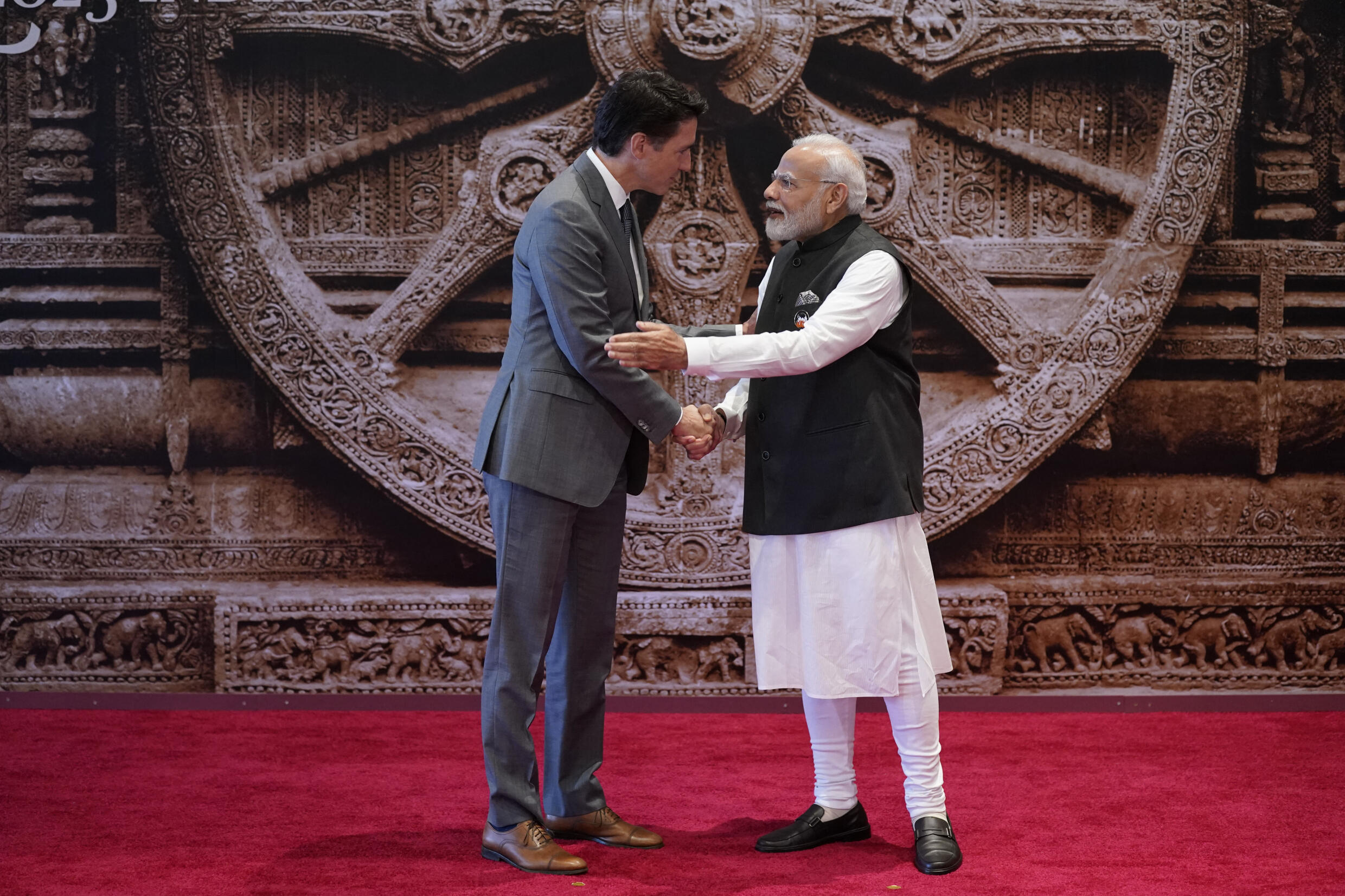 Indian Prime Minister Narendra Modi (R) shakes hands with Canadian Prime Minister Justin Trudeau before the G20 Leaders Summit in New Delhi on September 9, 2023.
