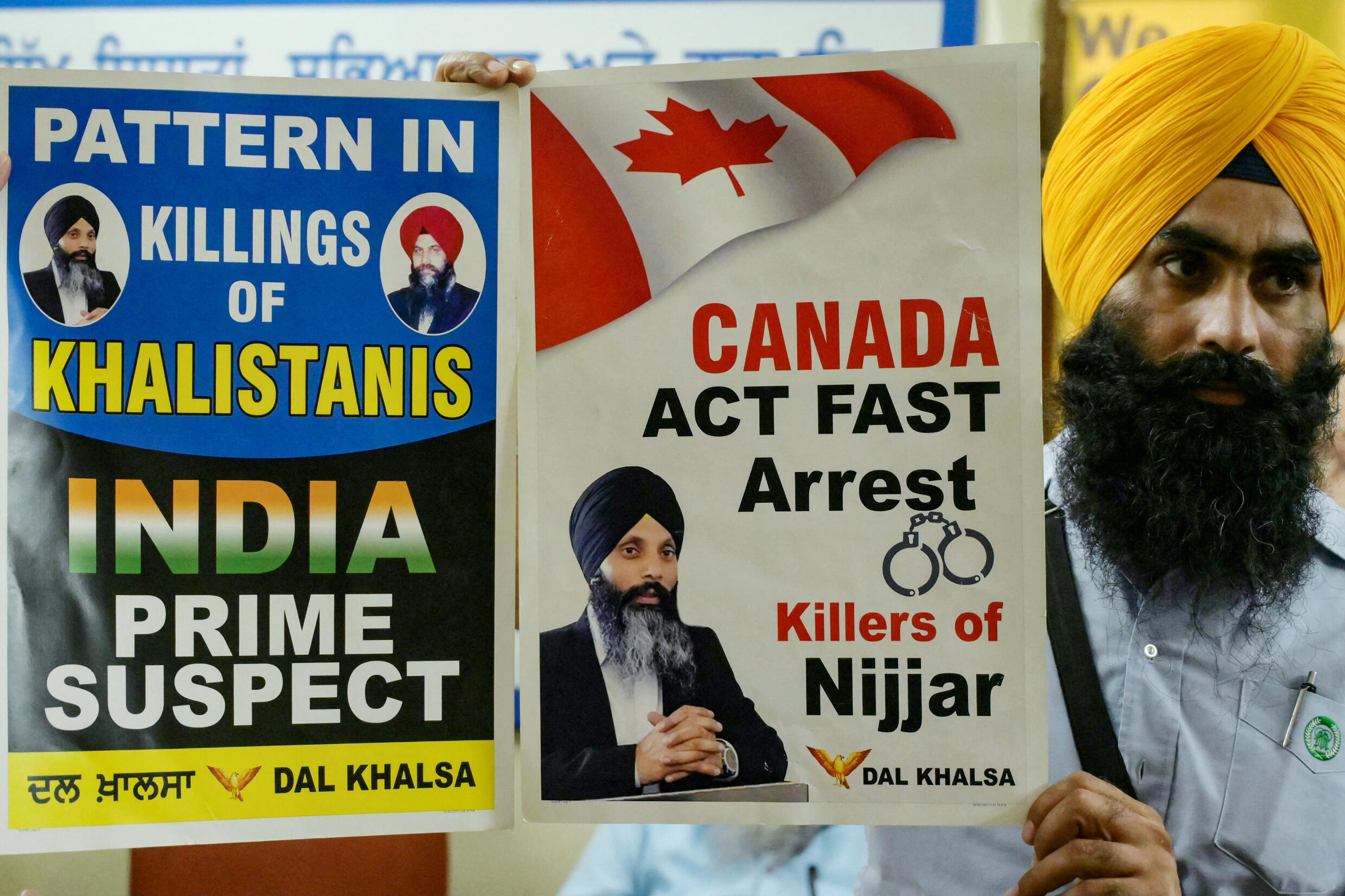 A member of a Sikh organization holds a banner with Sikh separatist Hardeep Singh Nijjar in Amritsar on September 22, 2023. Hardeep Singh Nijjar, an activist for the creation of an independent Sikh homeland called Khalistan, was wanted by Indian authorities for alleged terrorism and conspiracy to commit murder, and was shot dead by two masked assailants near Vancouver in June.